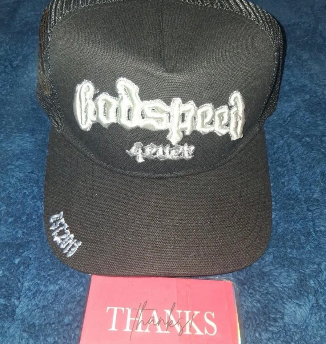 🖤 Godspeed Forever Trucker Hat – Black/White 🖤

Make a statement wherever you go with this bold Godspeed Forever trucker hat. Featuring premium raised embroidery, breathable mesh backing, and eye-catching side patches, this hat blends streetwear style w